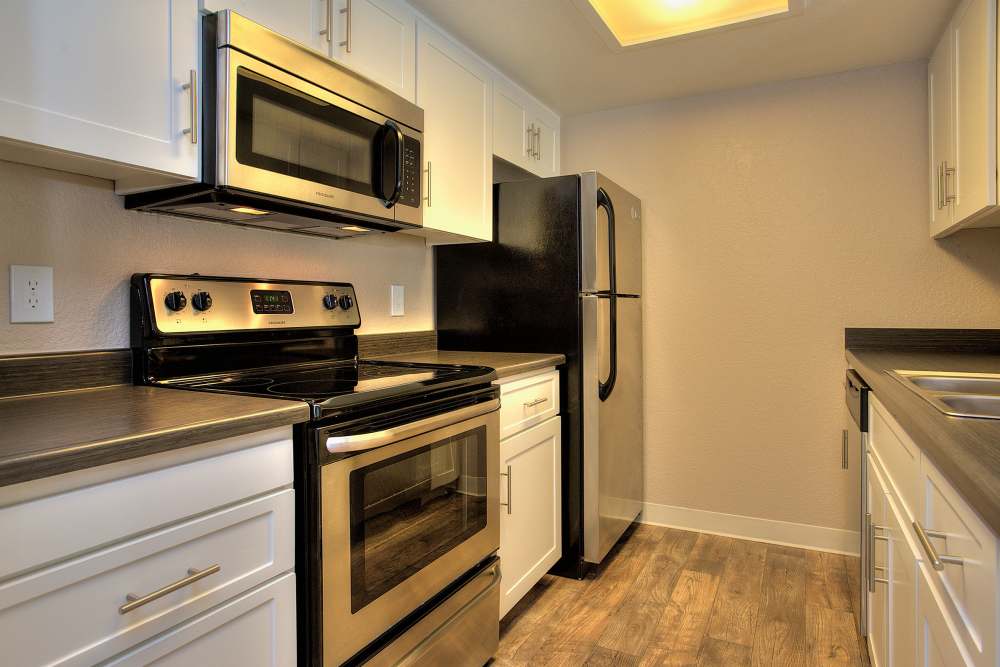 Cozy kitchen with stainless-steel appliances at Sandpiper Village Apartment Homes in Vacaville,California