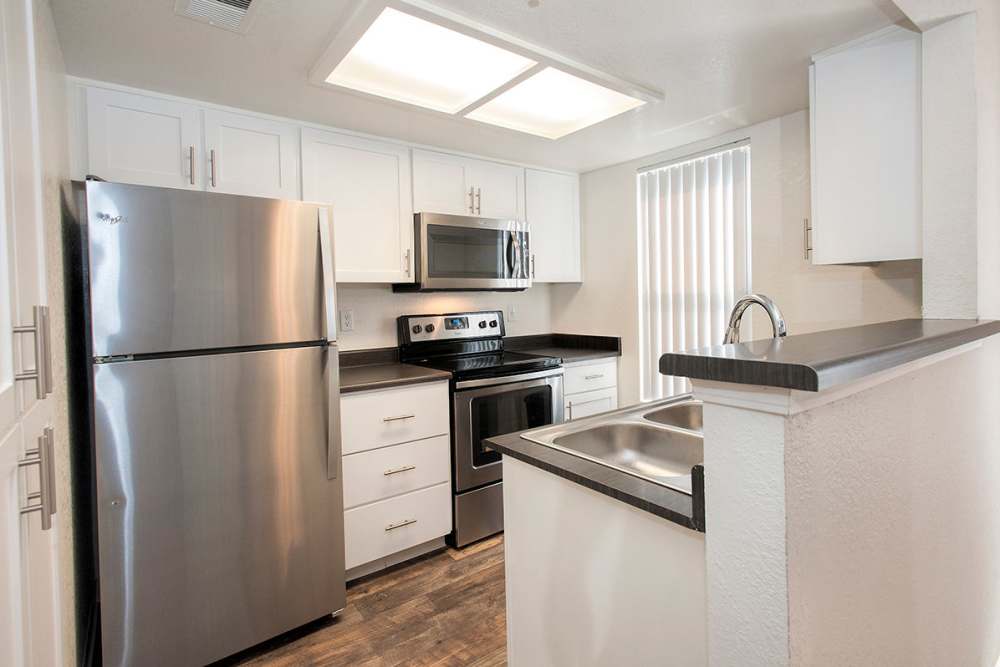 Kitchen with stainless steel appliances at Sandpiper Village Apartment Homes in Vacaville,California