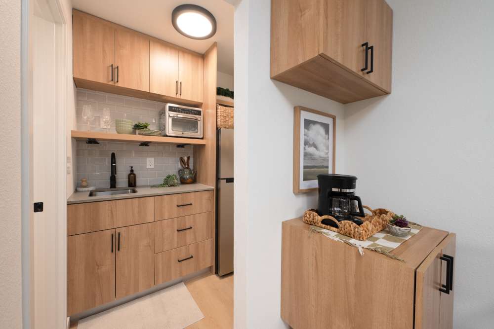 Kitchen and coffee corner at Bellevue Ridge Apartments in Bellevue, Washington  