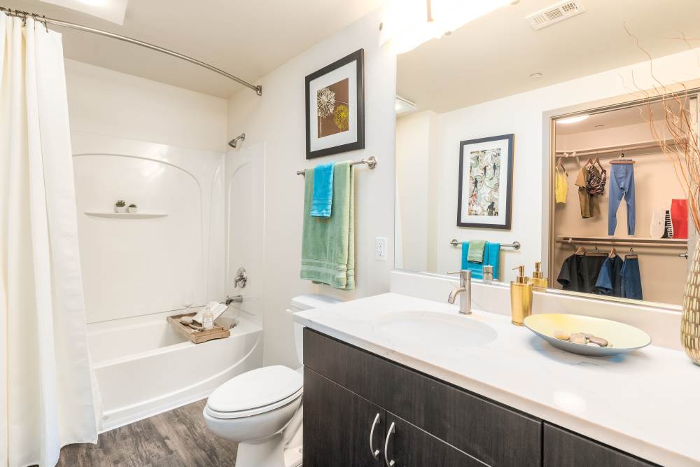 Bathroom with white vanity at LINQ Midtown in Sacramento,California