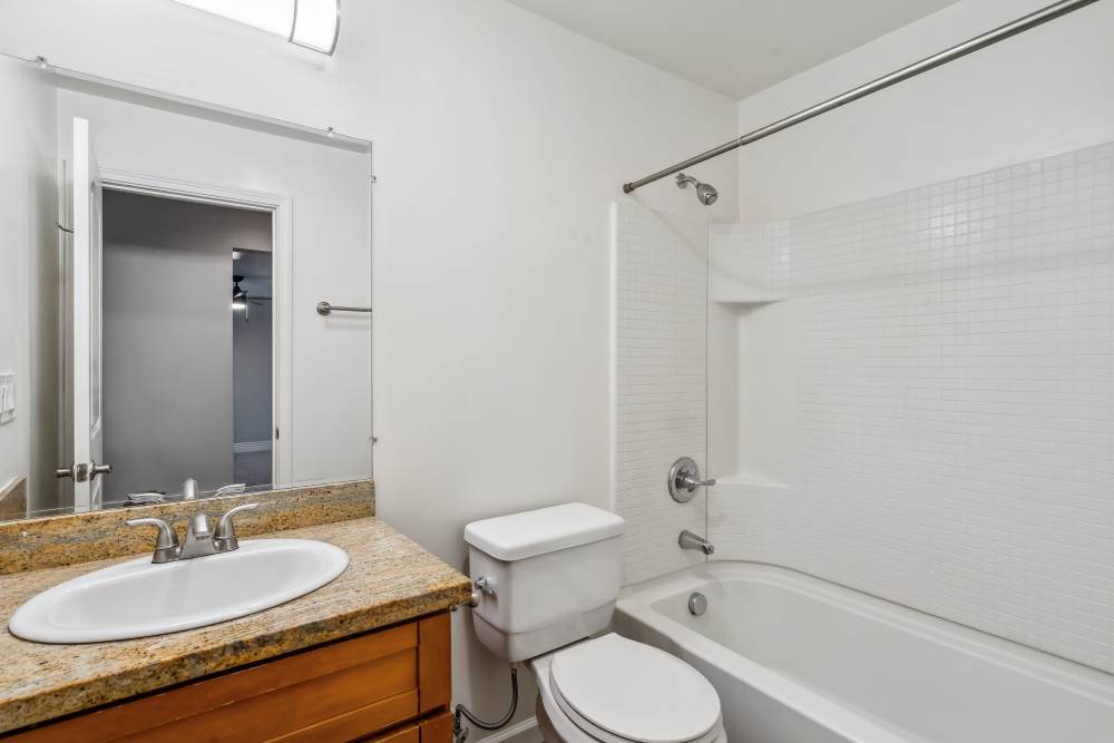 Bathroom with a tub at Regency Plaza Apartment Homes in Martinez, California