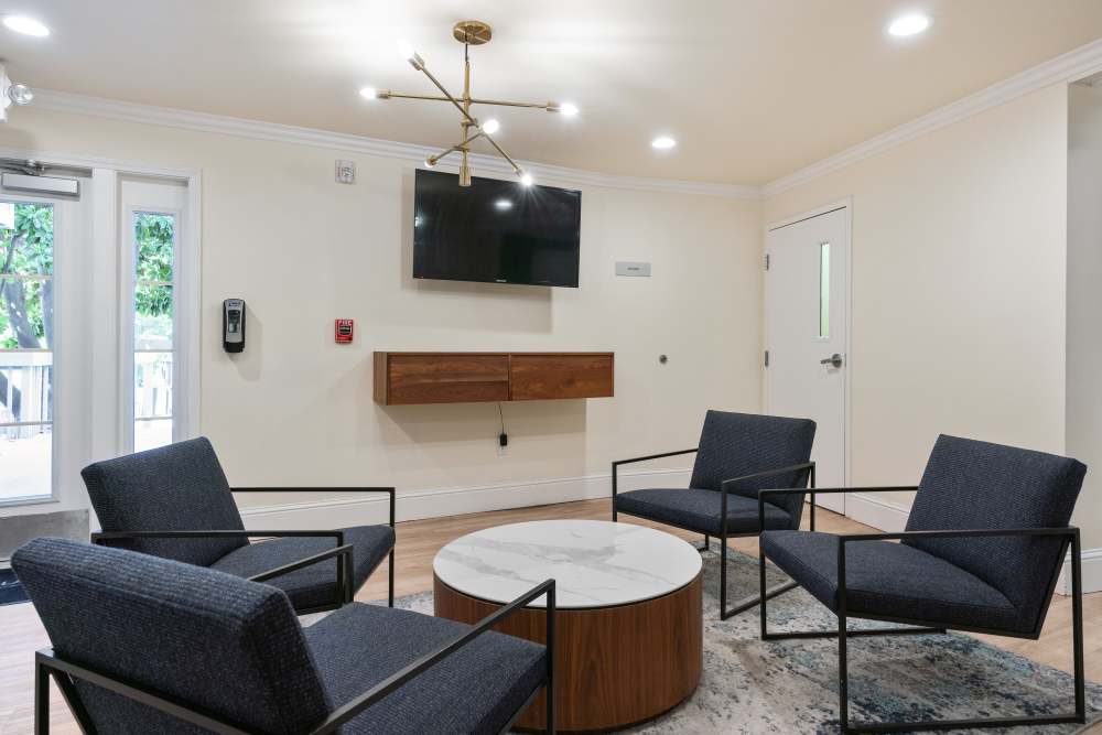Indoor lounge with lighting at Regency Plaza Apartment Homes in Martinez, California