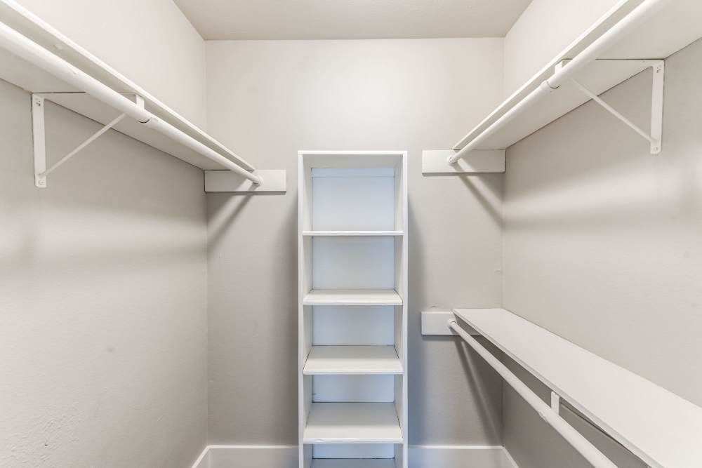 Large closet with wooden rack at Warwick at Westchase in Houston, Texas