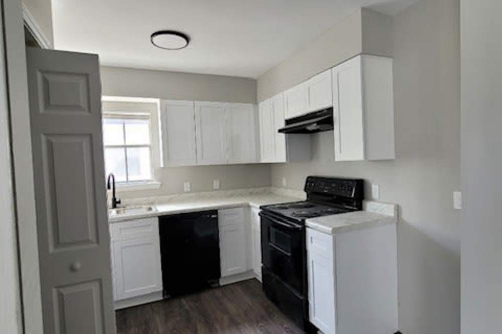 Kitchen with white color cabinet  at Stonebridge Manor Apartments in Gretna, Louisiana