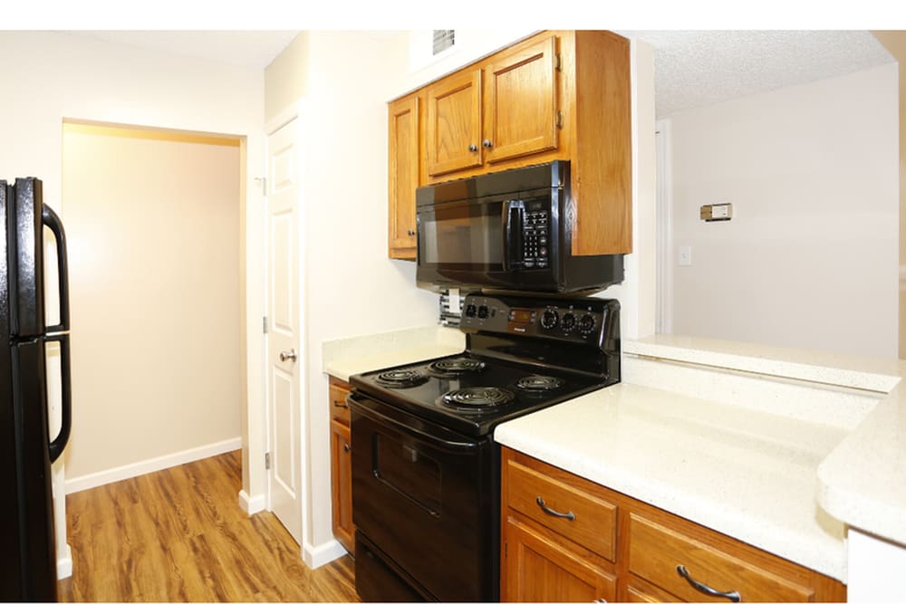 Kitchen with wooden cabinetry at Beau Terre in Alexandria,Louisiana
