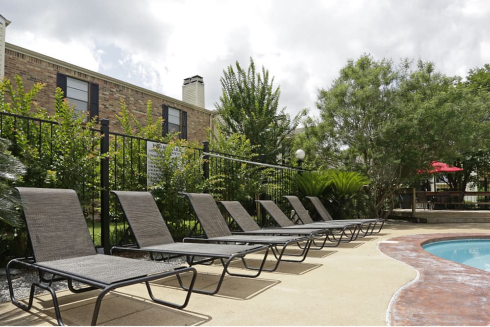 Lounge chairs by the community pool at Beau Terre in Alexandria,Louisiana