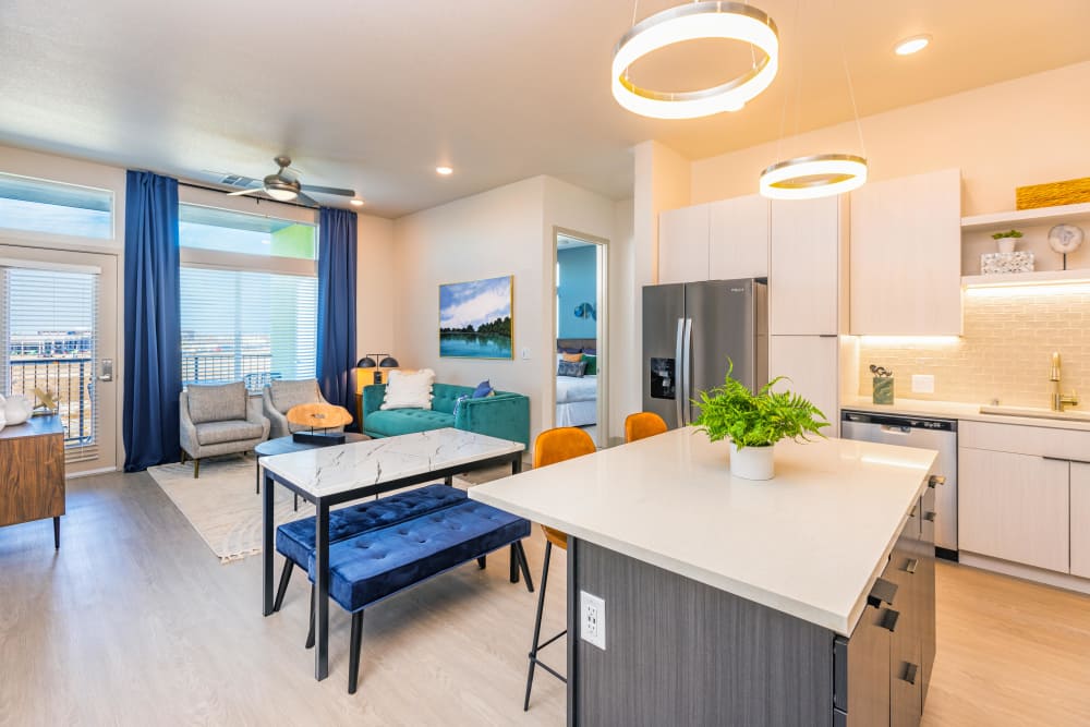 Separate dining room with kitchen table and view of living room at Zeta Luxury Apartments in Sacramento, California