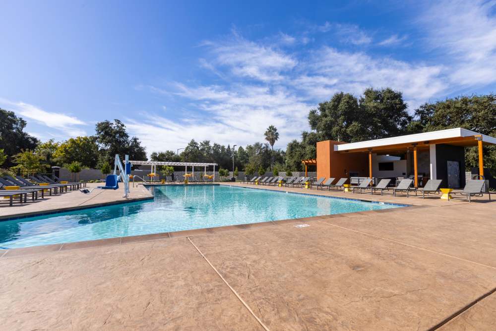 Swimming pool with lounge beds at Solasta in Sacramento, California