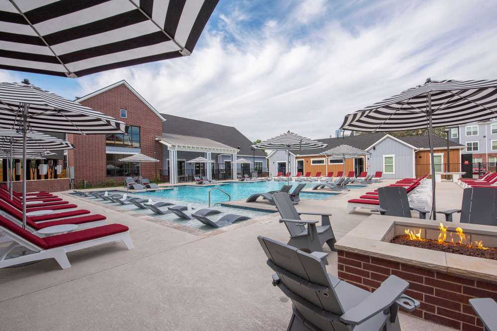 New resort style pool with lounge chairs at The Landing College Station