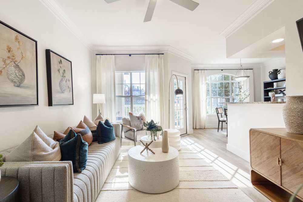 Bright living room with white accent at The Kinsley at Perimeter Center in Atlanta, Georgia