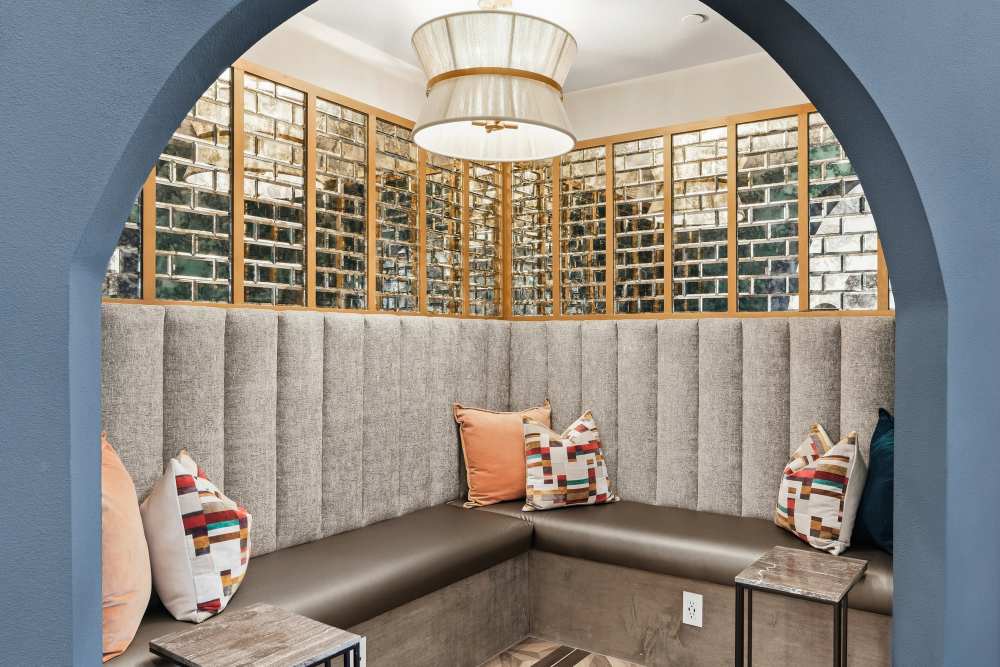 Clubhouse with modern design and open layout at The Heyward Apartments in Corinth, Texas.