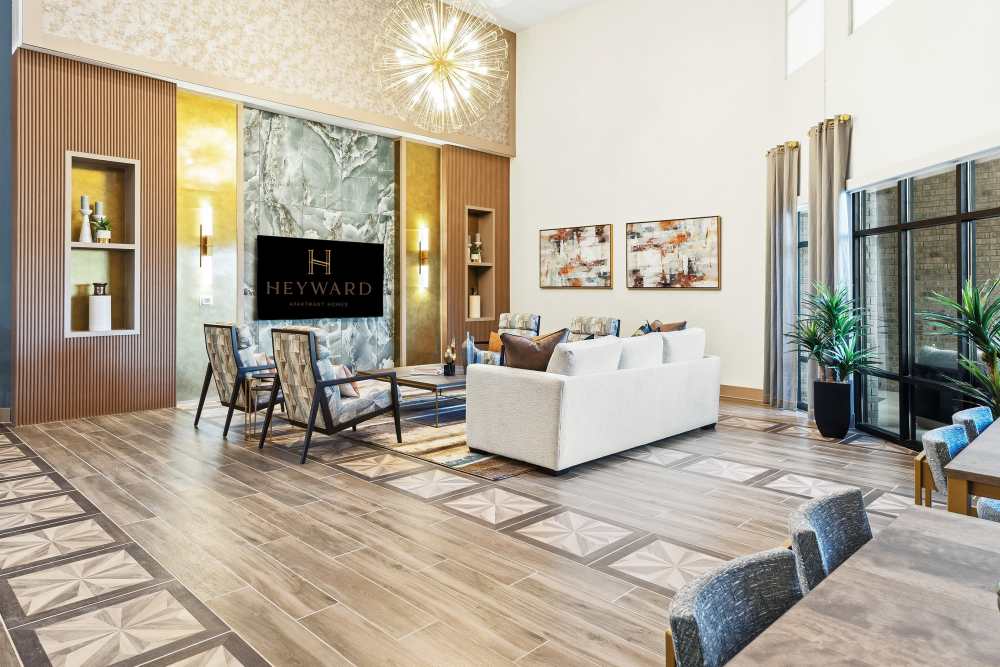 Entryway with round table and decorative lighting at The Heyward Apartments in Corinth, Texas.
