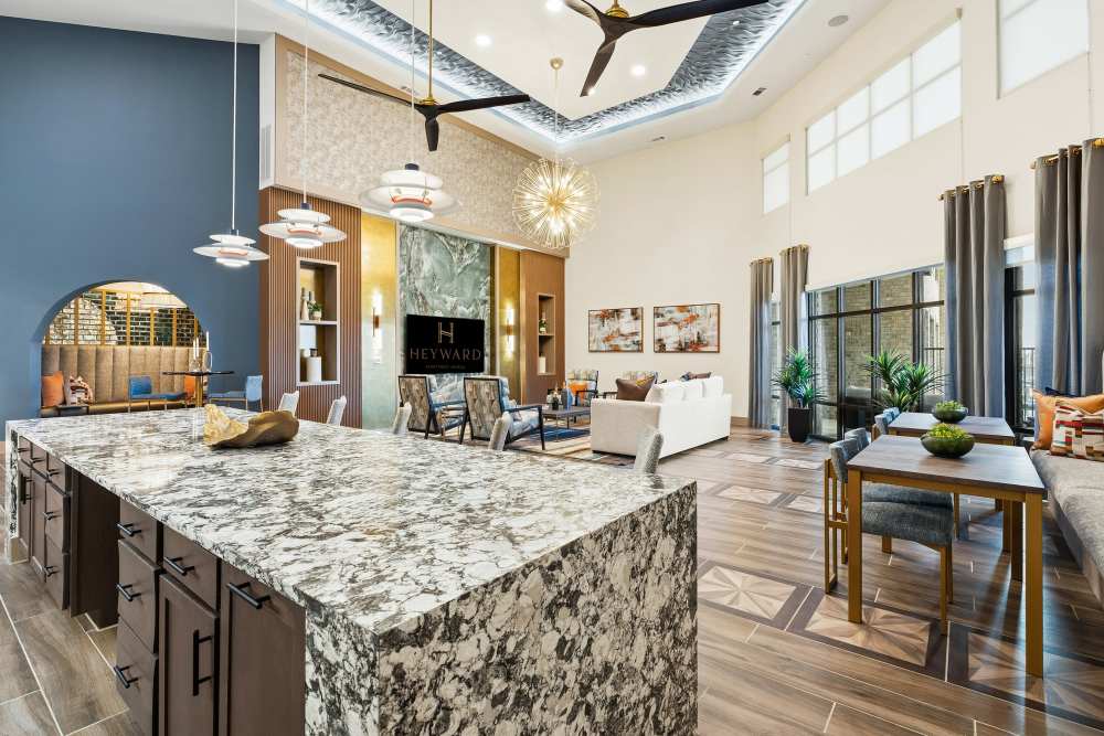 Lounge seating with archway and mirrored panels at The Heyward Apartments in Corinth, Texas.