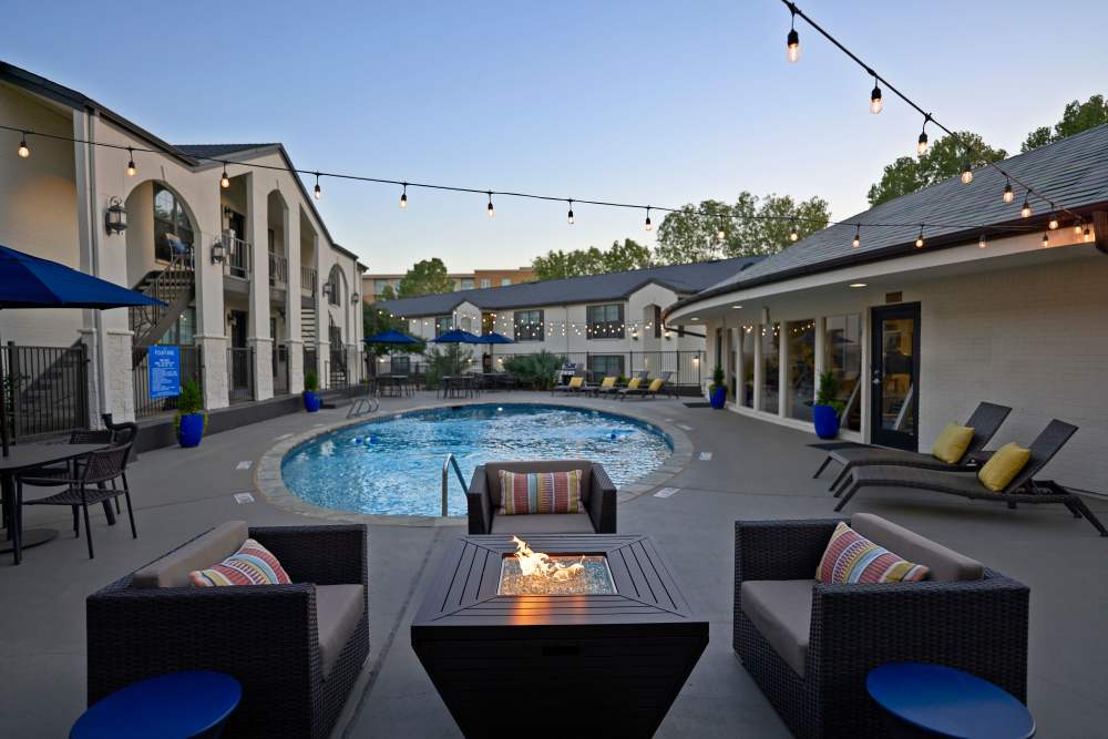 Pool seating with fireplace at The Fountains of Preston Hollow in Dallas, Texas