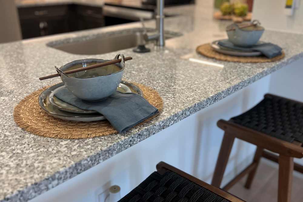 Granite countertops and a large island provide plenty of space for sharing your favorite meal at Fidelis Willis