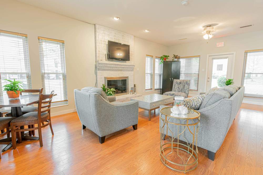 Combined view of the dining area and living roomat Peachtree Apartments in Chesterfield, Missouri