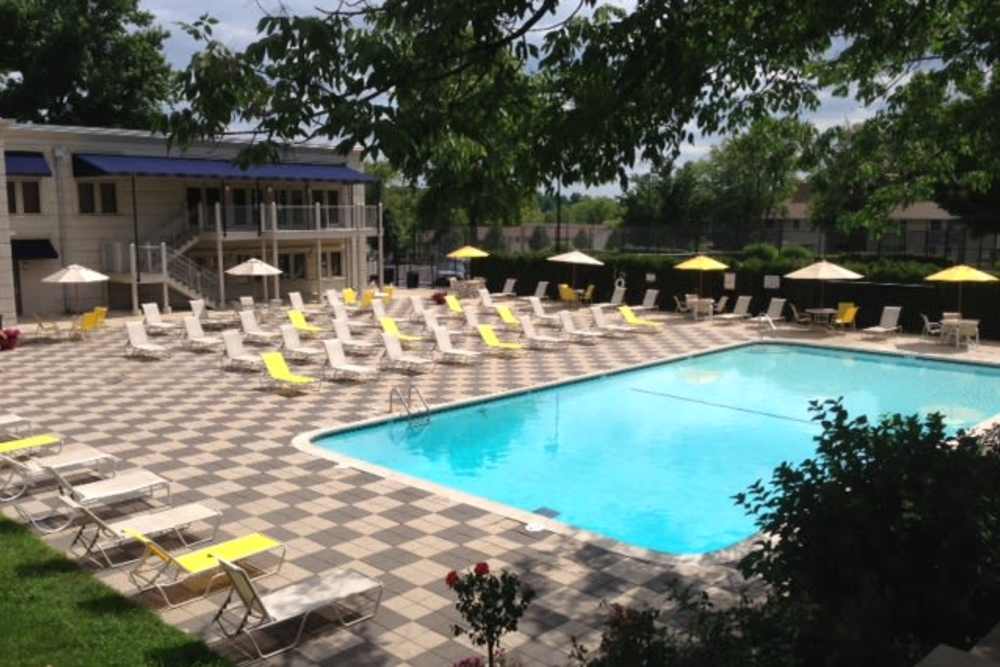 Community pool with lots of lounge chairs at The Pavilion in Maryland Heights, Missouri