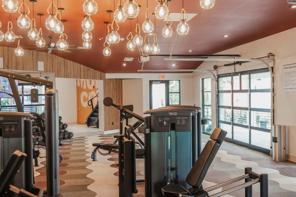 Well-Equipped Fitness Room With Exercise Equipment at The Quarters Starkville in Starkville, Mississippi