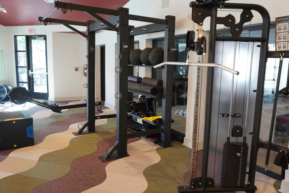 Well-Equipped Fitness Room With Exercise Equipment at The Quarters Starkville in Starkville, Mississippi