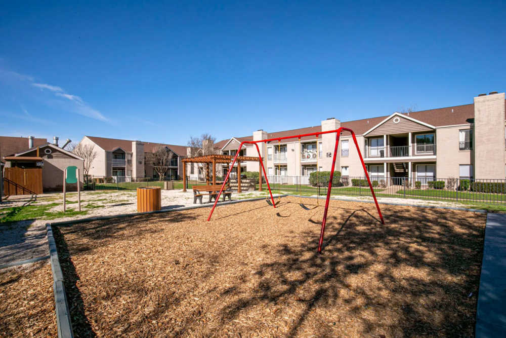 Community play area at Derby Park Apartments in Round Rock, Texas