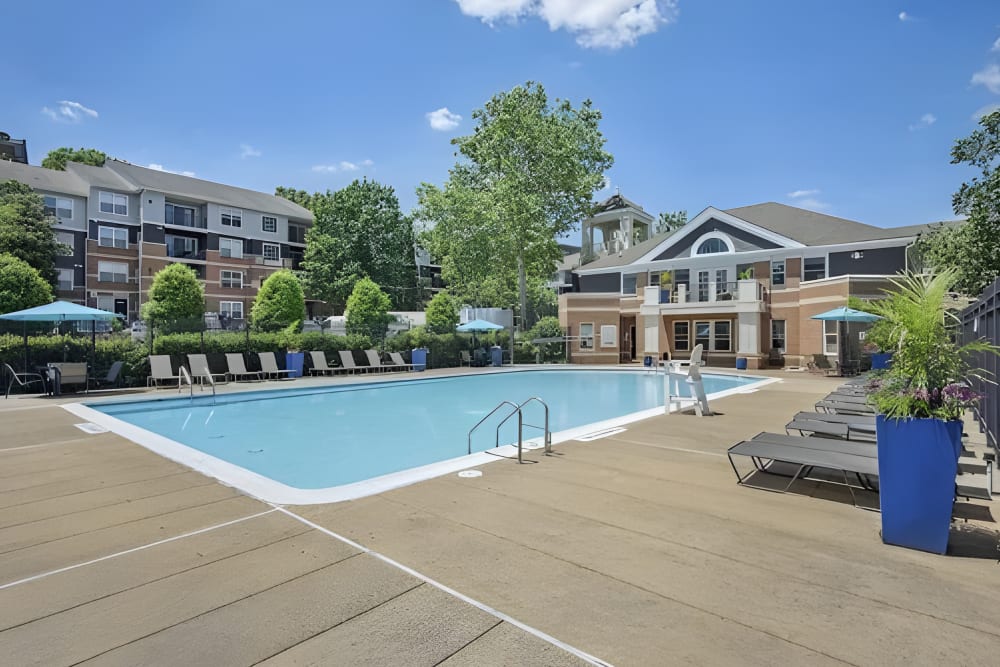 Swimming pool with lounge chairs at Eagle Rock Apartments at Columbia Pike in Arlington, Virginia