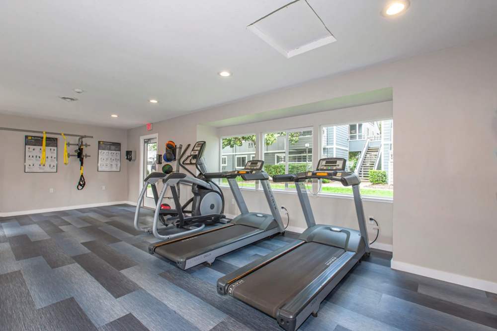 Fitness center with lots of window at Bennington Apartments in Fairfield, California