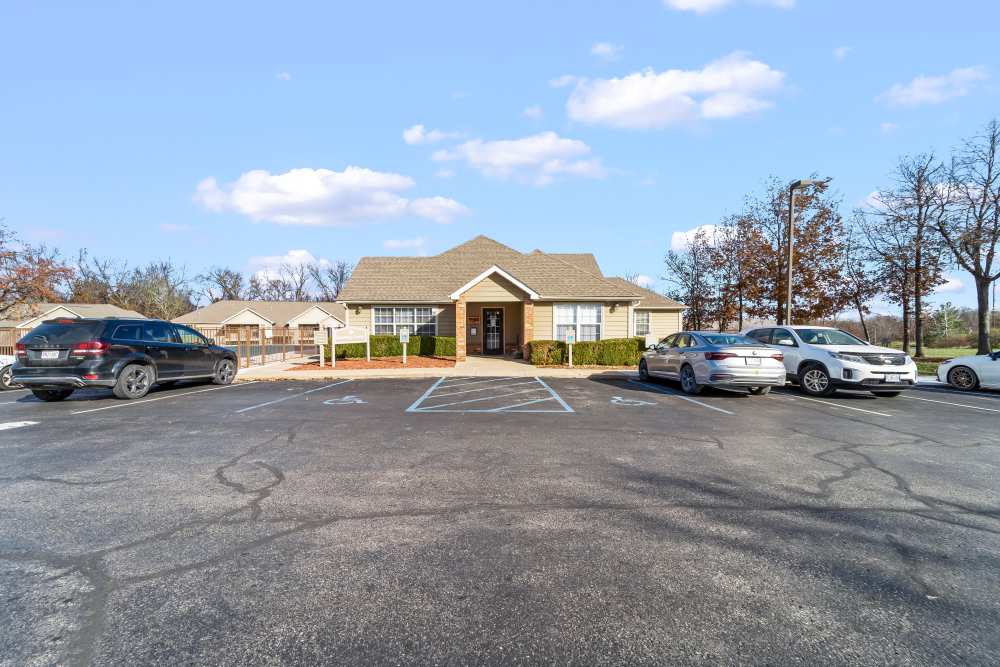 Leasing office and few cars out side at Callaway Village Apartments in Fulton, Missouri