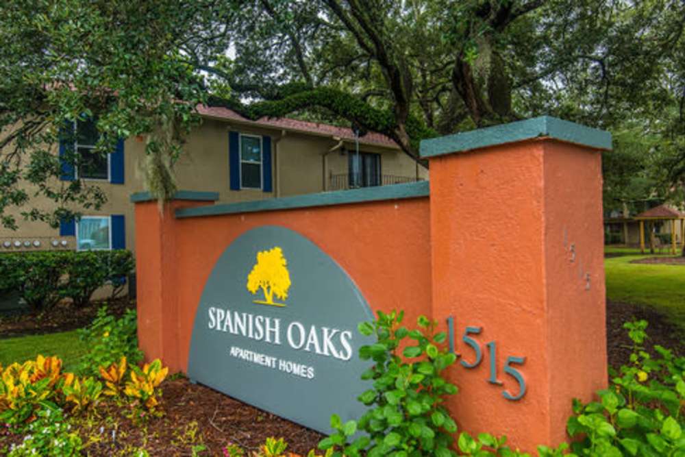 Spanish Oaks Apartment Homes entrance sign with landscaping at Spanish Oaks in Charleston, South Carolina