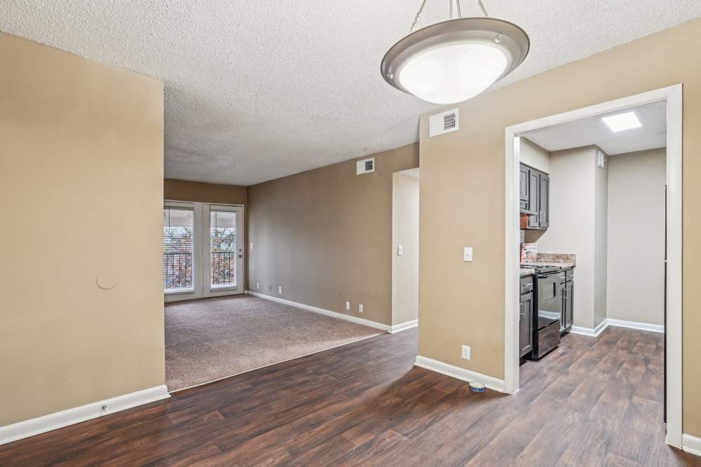 Dining room view looking into kitchen and living room carpet