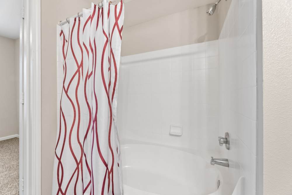 Shower with curtain at Columbia Greens in Houston, Texas