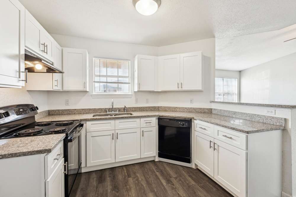 Kitchen with black appliances at Casa Quintana in Freeport, Texas