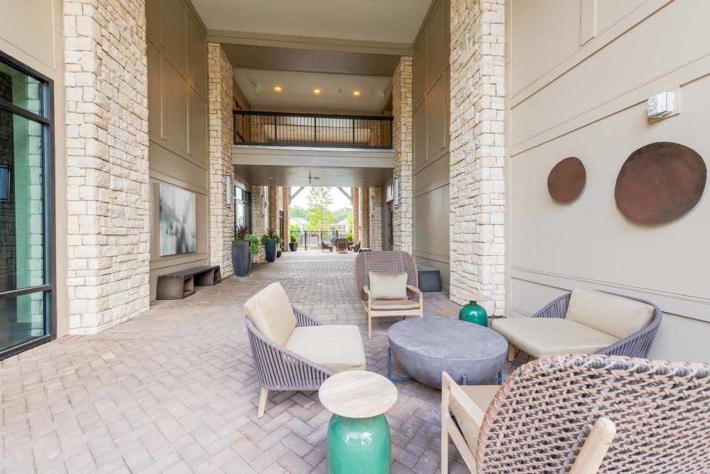outdoor lounge area with chairs and tables The Reserve at Patterson Place  durham NC luxury apartments