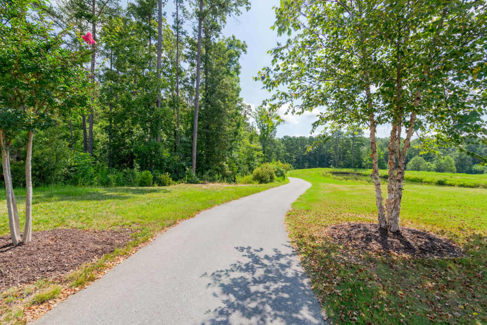 walking path and bench The Reserve at Patterson Place  durham NC luxury apartments