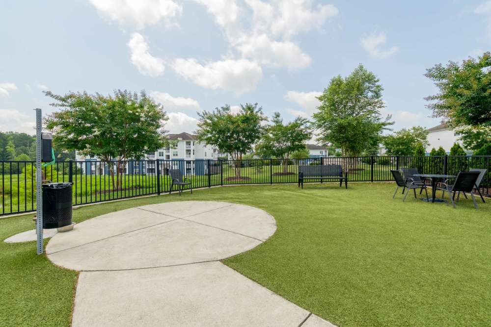 outdoor area with chairs and tables The Reserve at Patterson Place durham NC luxury apartments