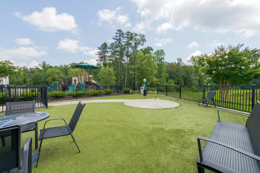 outdoor area with chairs and tables The Reserve at Patterson Place durham NC luxury apartments