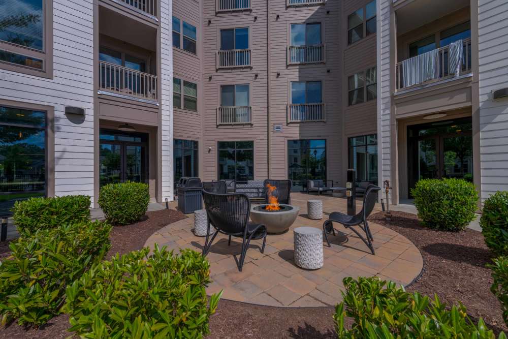 outdoor fire pit with chairs The Reserve at Patterson Place durham NC luxury apartments