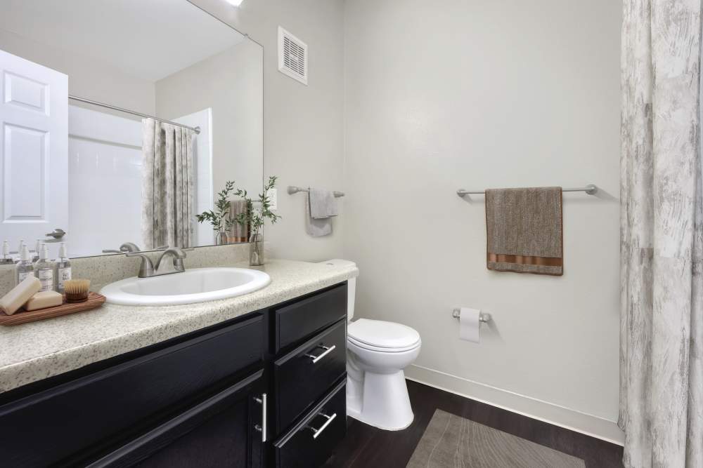Bathroom with vanity and a tub at Westridge Apartments in Aurora, Colorado