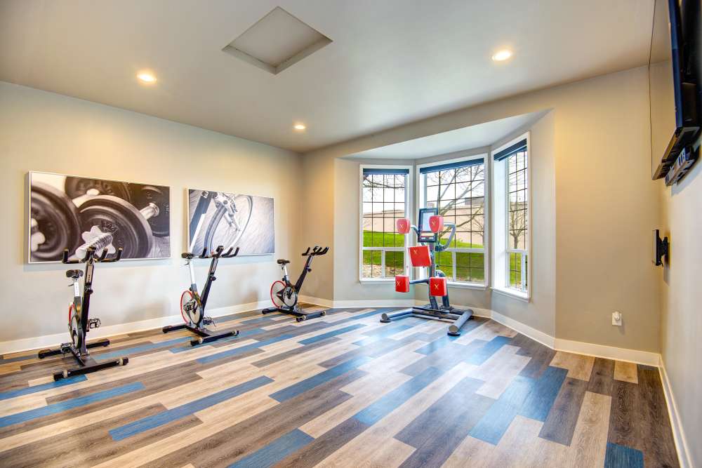 Fitness center with plenty of individual workout stations at Wellington Apartments in Silverdale, Washington