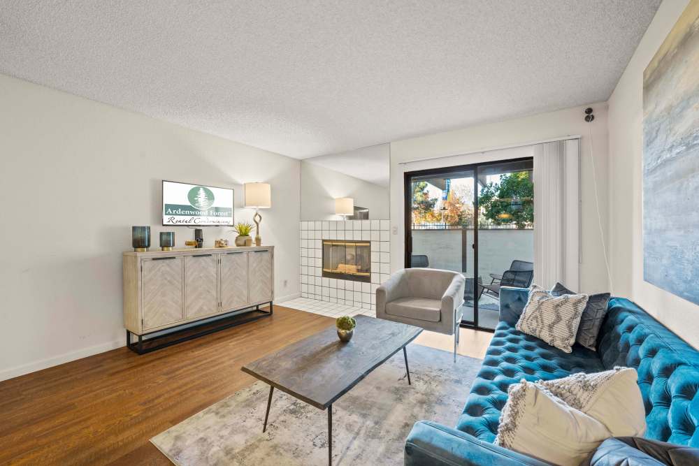 Living room with large windows at Ardenwood Forest Rental Condominiums in Fremont, California