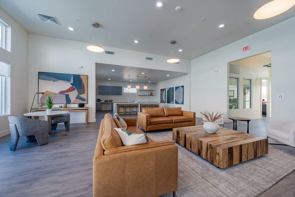 Resident clubhouse with leather sofas at Overland Flats in Maricopa, Arizona