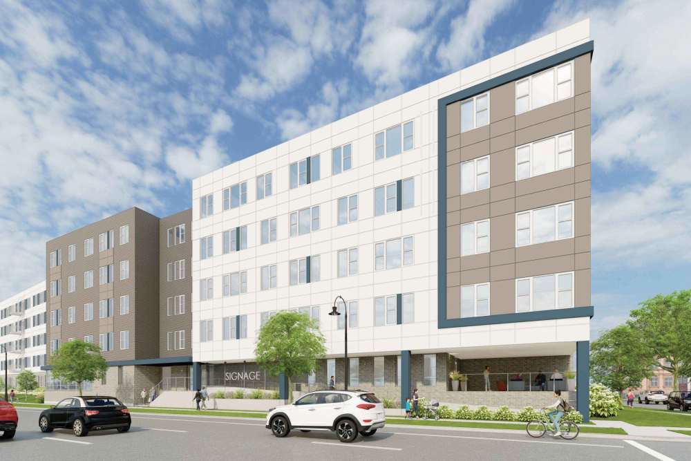 Beautiful landscaped courtyard with flowering trees at The Intersect in Madison, Wisconsin