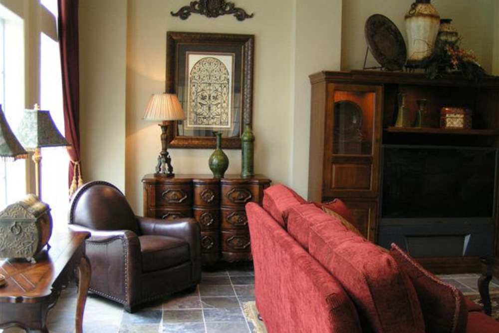 Cozy living room with plush seating and elegant decor at Country Lane in Angleton, Texas