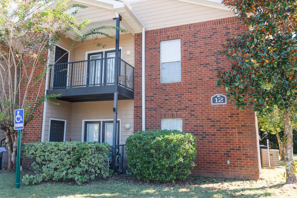 Exterior shot of the building with balconies at Annandale Park in Robertsdale, Alabama