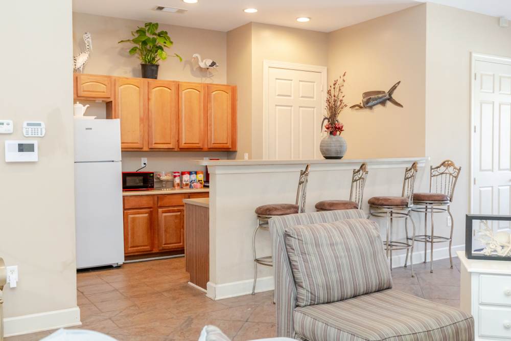 Kitchen with wooden cabinets at Annandale Park in Robertsdale, Alabama