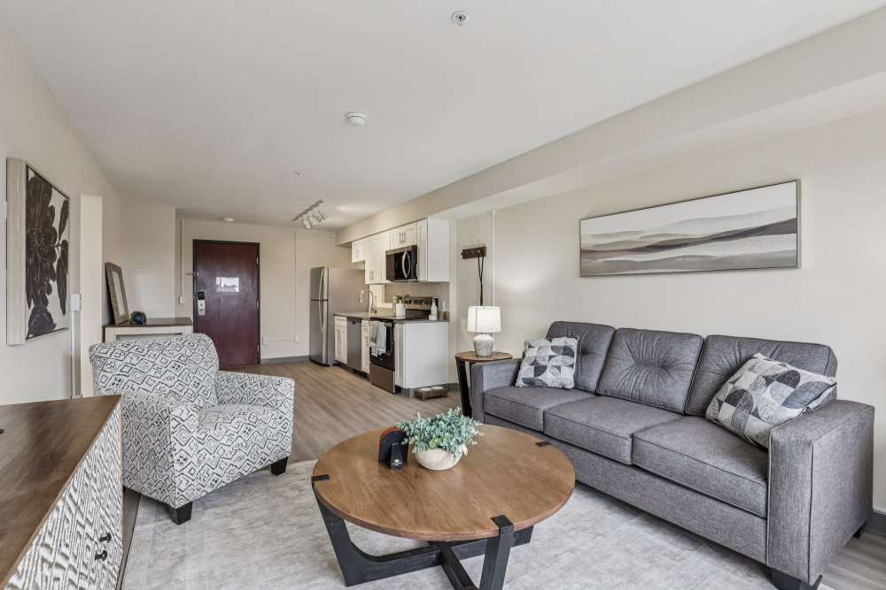 Living room with kitchen at Woodland Flats in Gresham, Oregon