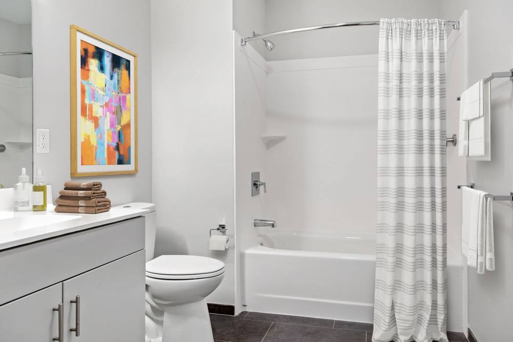 Modern bathroom with bathtub and toilet at The Lighthouses in Salem, Massachusetts