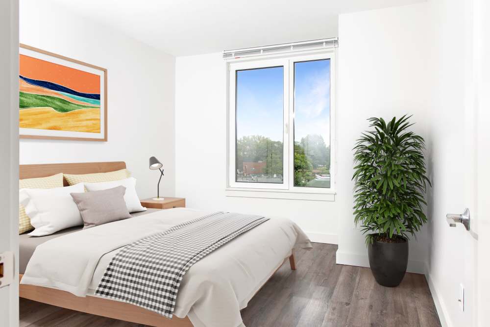 Bedroom with large window at The Lighthouses in Salem, Massachusetts