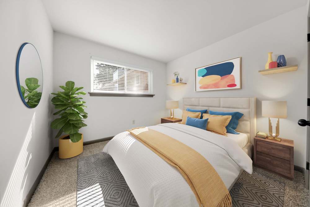 Bright bedroom with modern decor and lively plants at Parkside Landing Apartments in Rockville, Maryland