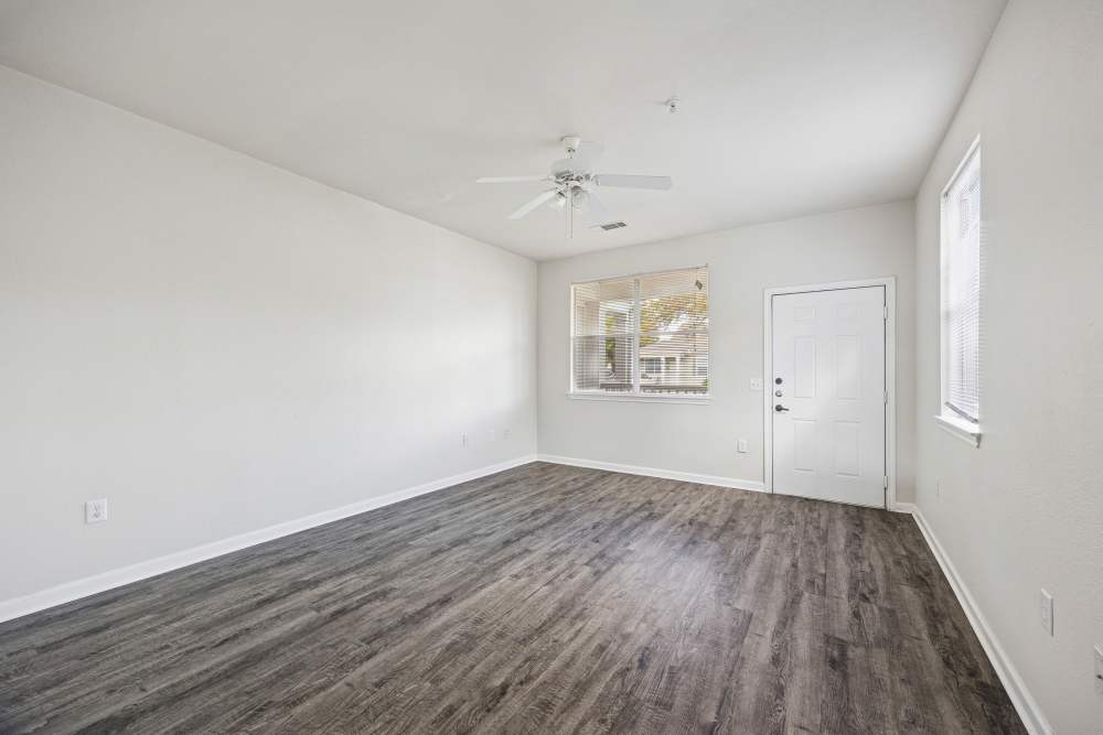 Living room with large window at Gibraltar Senior in Clute, Texas
