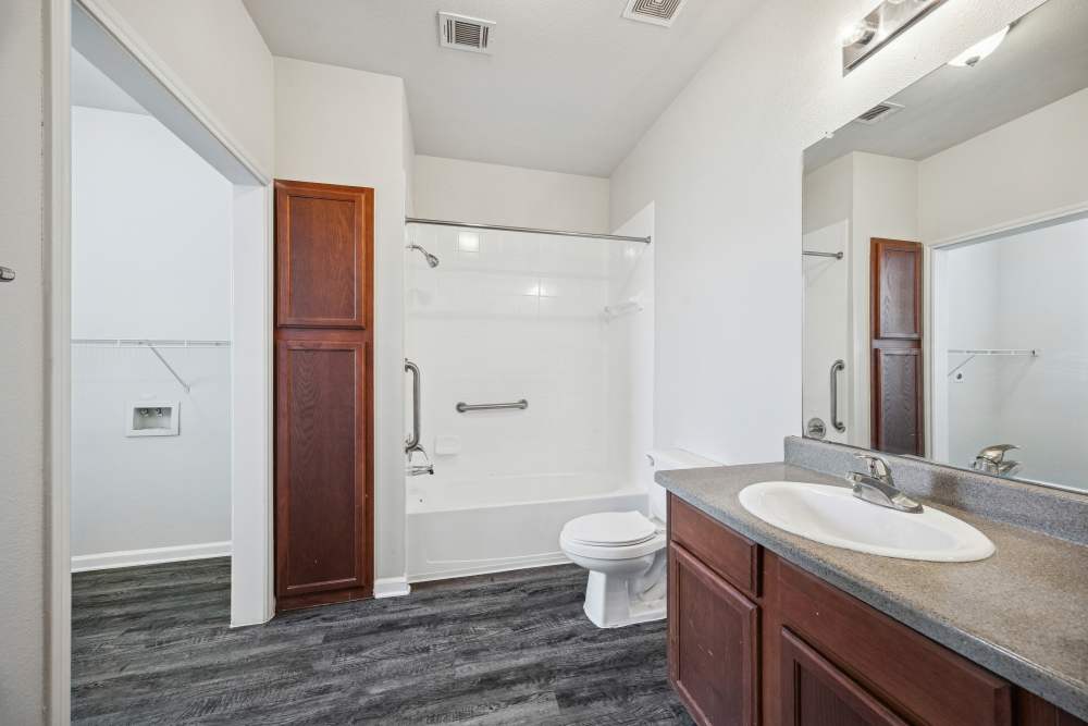 Bathroom with shower and tub at Gibraltar Senior in Clute, Texas